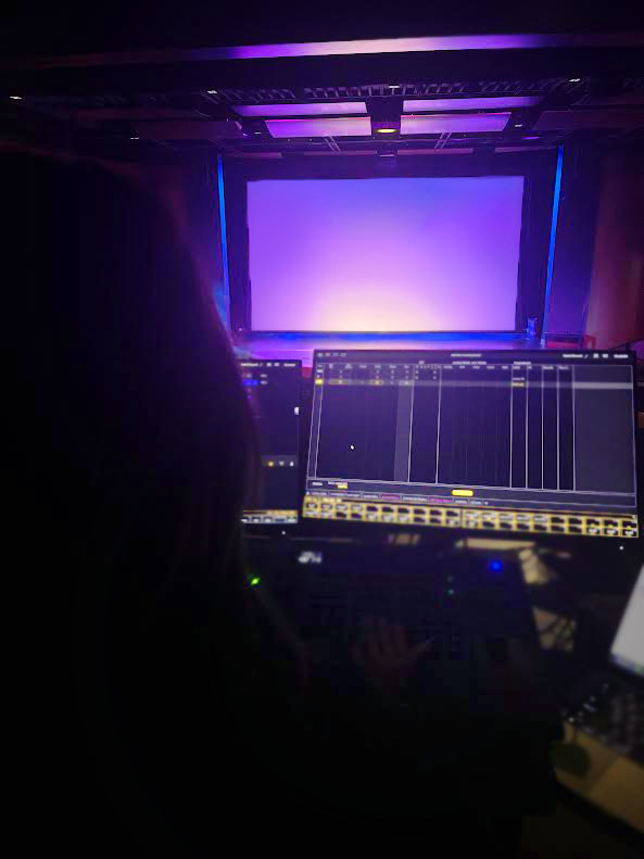 Harper Clark in the lighting booth