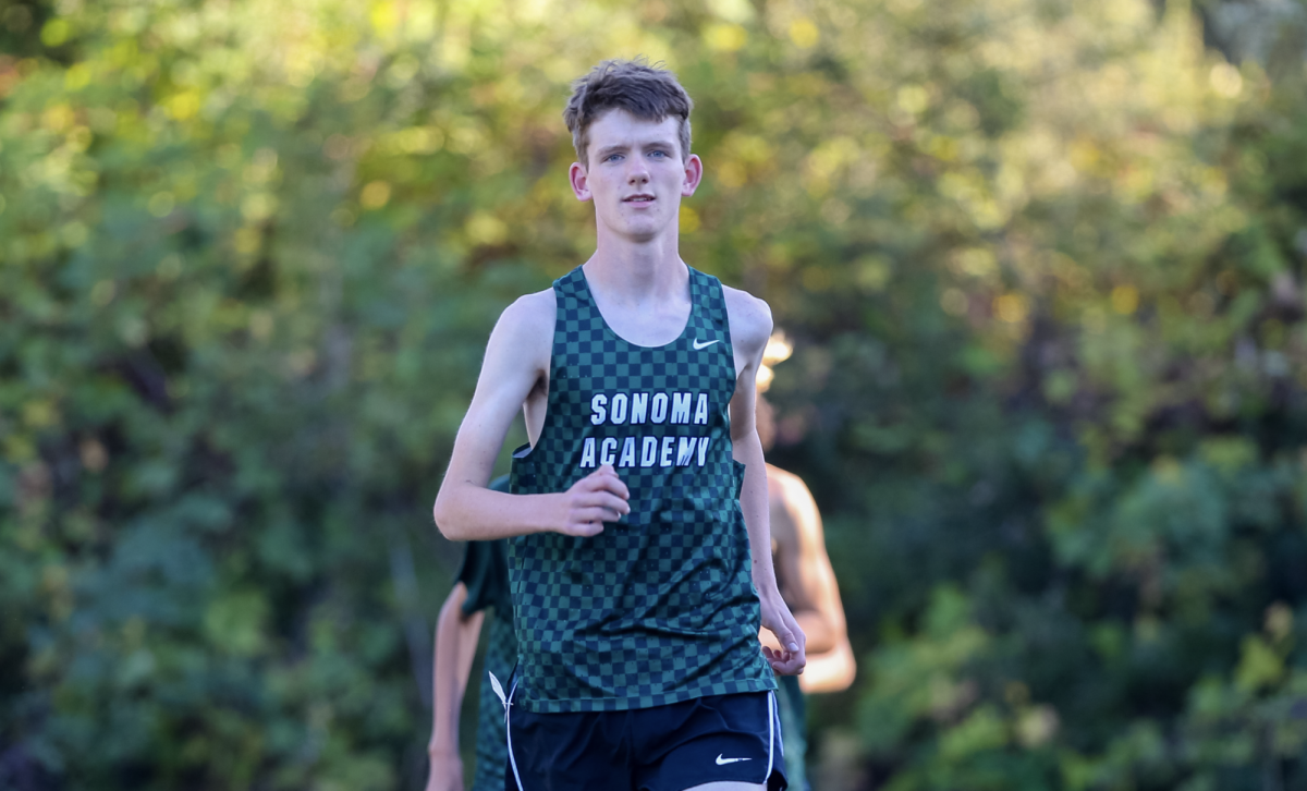 Coe Dexter ('26) running for the Cross Country team in the 2023-24 season