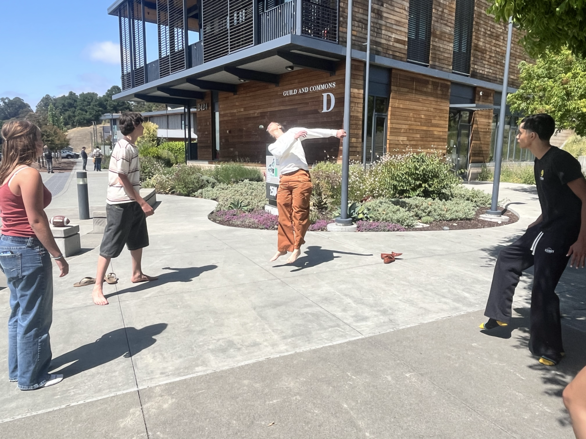 Kim Eber and students playing Hacky Sack